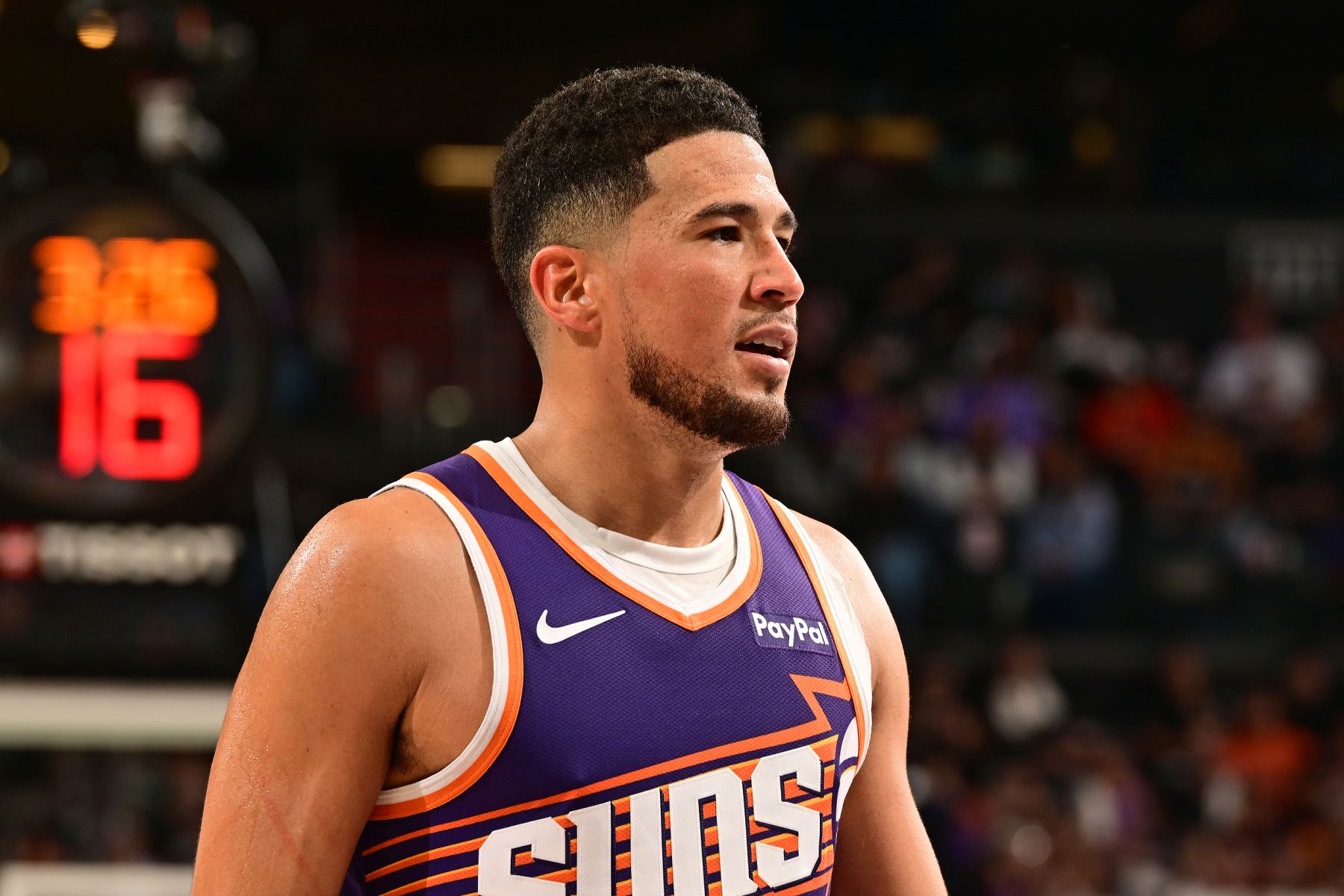 Booker scored a season-high 38 points, and the Suns lost to the Warriors by 11 points